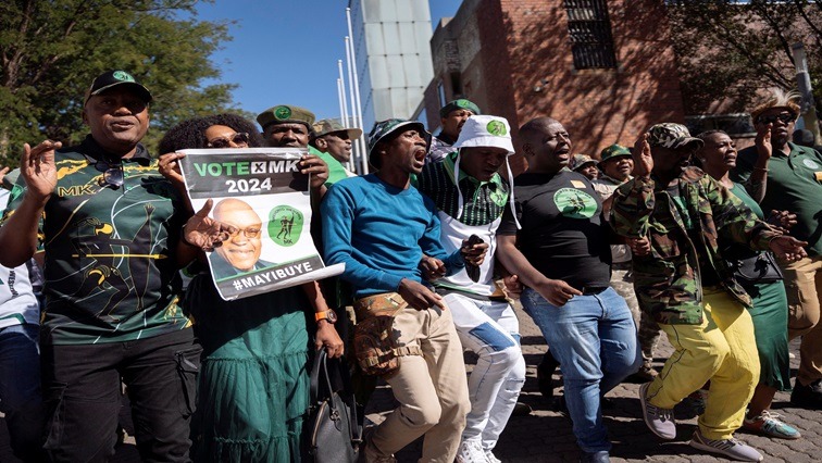 Supporters of former President Jacob Zuma protest outside the court in Johannesburg.