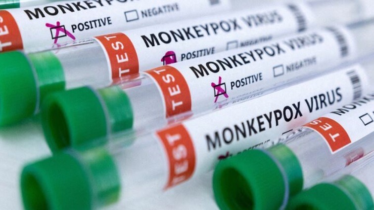 Test tubes labeled "Monkeypox virus positive and negative" are seen in this illustration.